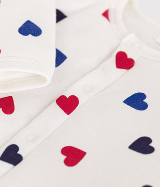 BABY UNISEX ORGANIC COTTON PADDED FOOTLESS SLEEPSUIT IN ICONIC HEART PRINT