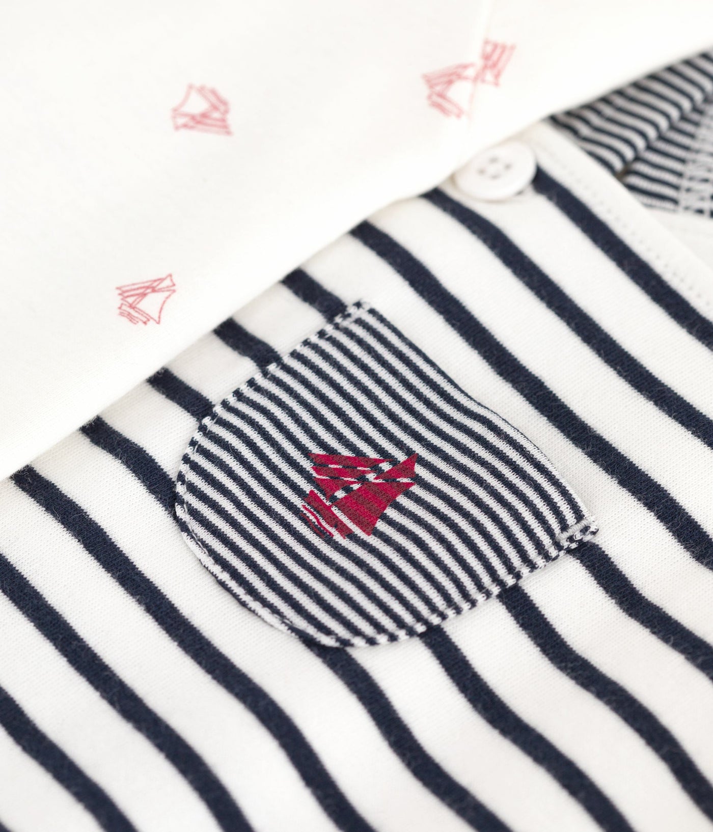 BABIES' OUTFIT WITH BRETON STRIPED DUNGAREES AND A PRINTED BODY