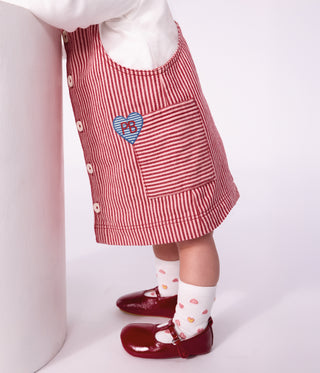 BABY GIRL'S SLEEVELESS STRIPY COTTON DRESS WITH A HEART BADGE