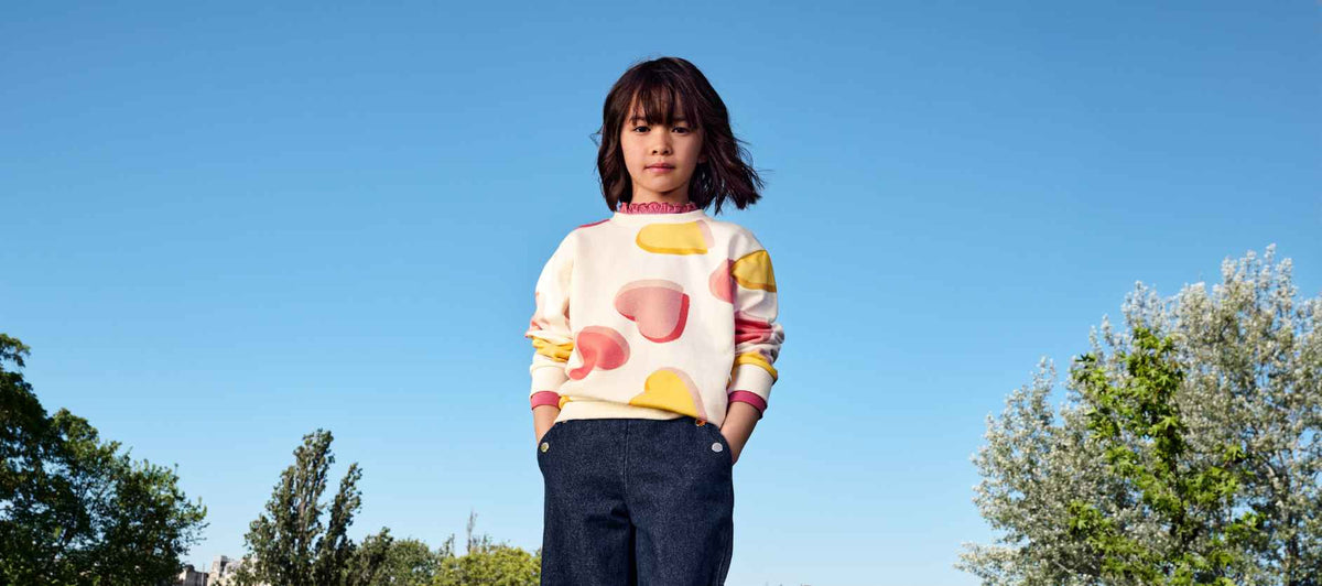 girl wearing hearts print sweatshirt from autumn 2026 collection