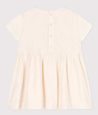 Petit Bateau DRESS MADE OF BRODERIE ANGLAISE: A SOPHISTICATED FABRIC PERFECT FOR SMARTER OCCASIONS.<br>Feminine detailing with a ruched front and armhole ruffles.<br>Bloomers in the same material give you the complete look.<br>Button fastening on the back: handy when getting baby dressed.